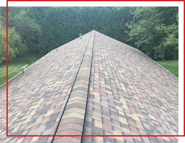 An asphalt shingle roof on a Minnesota home in the summer.