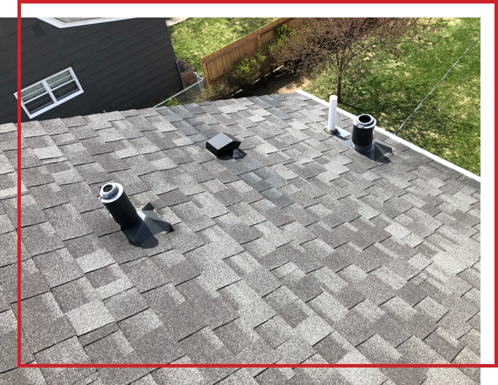An asphalt shingle roof in the sun.