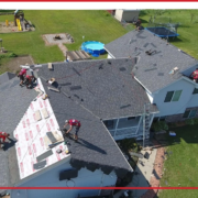 A team of roofers works on a roofing replacement project in Minnesota.