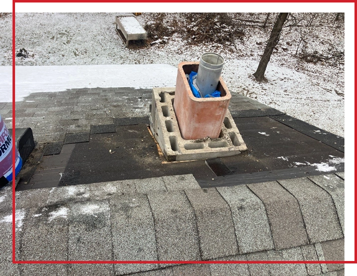 Roofing being replaced around a chimney on a house in Minnesota.