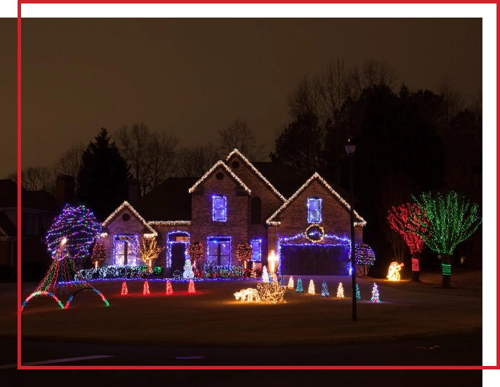 A house with exterior Christmas lights and decorations.