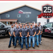 BD Exteriors team photo with company vehicles in Central MN.