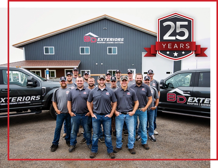 BD Exteriors team photo with company vehicles in Central MN.