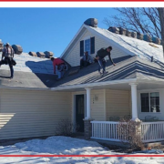 Winter roofing project in Central MN showing professional installation under cold conditions.