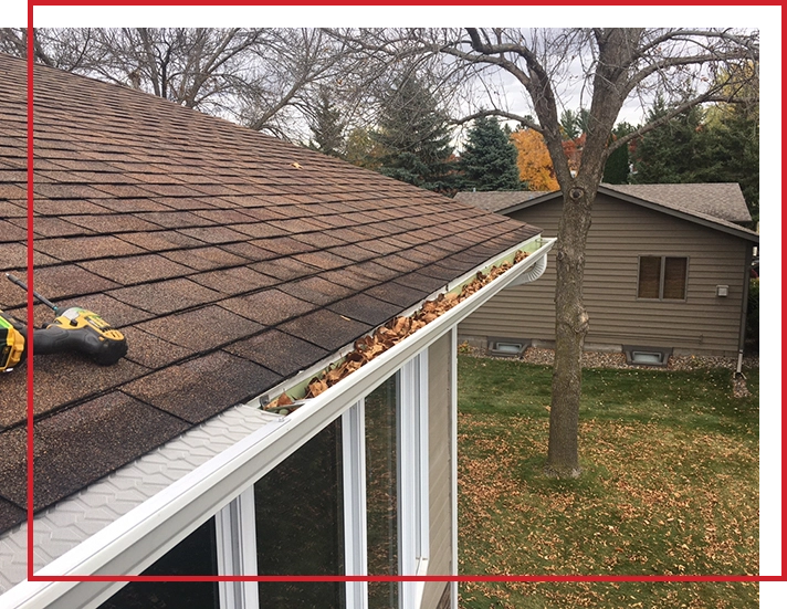 A section of gutters that is full of leaves.