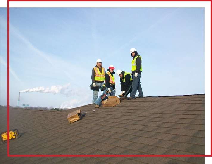 BD Exteriors roofing crew inspecting a Central Minnesota roof.