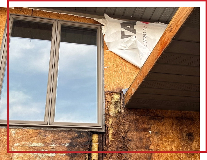 A house that has rot underneath the siding.