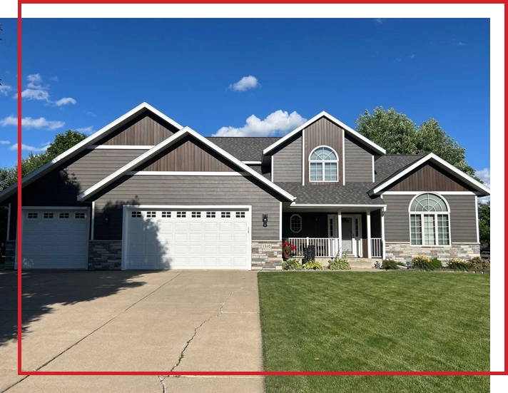 Well-designed Central Minnesota home exterior with coordinated roofing, siding, trim, and gutters.